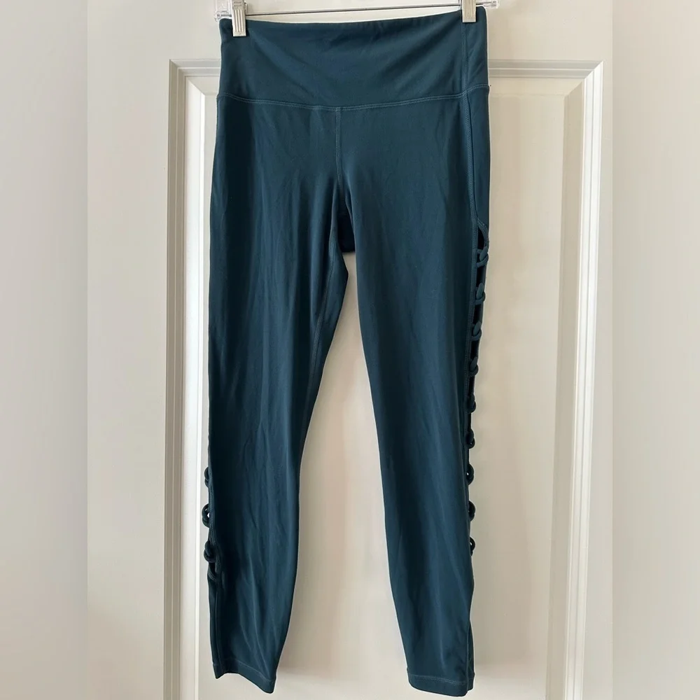 TEAL Color: Athleta Shiva 7/8 Leggings. Cut out sides. Size Small. EUC